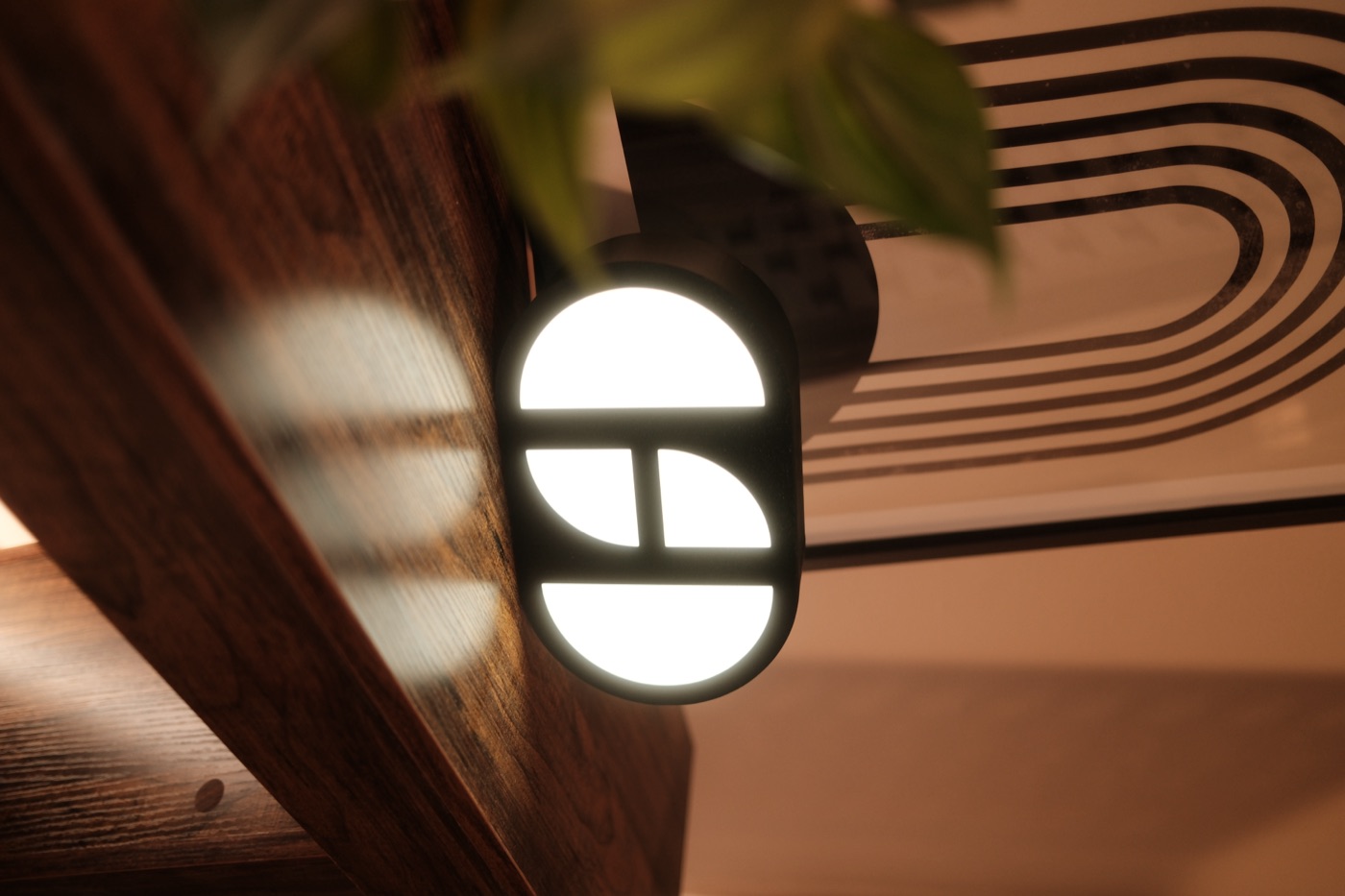 The Hemisphere Studios logo light on the sideboard.
